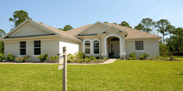 A home with freshly cut grass and great landscaping 