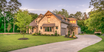 a house with a landscaped lawn 