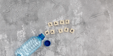 water bottle on the ground with pieces that say 